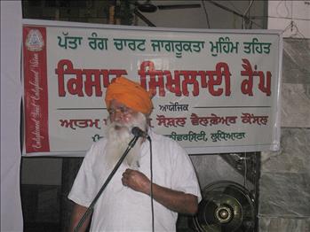 A farmer having some clarification during Leaf Color Chart Awareness Campaign.