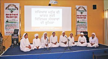 Students singing the opening prayers during the event.