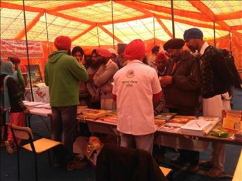 Volunteers addressing the queries of oncoming visitors.