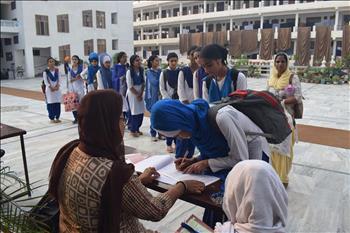 The registration desk set by volunteers for completing registration 
