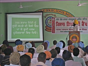 The soil sampling procedure being discussed by Dr. Varinderpal Singh