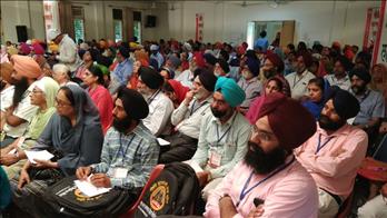 Teachers, Principals and Staff members at conference listening to speakers with keen interest