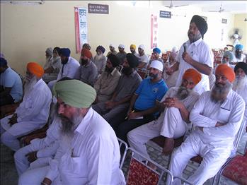 The farmer sharing his words with the delegates.