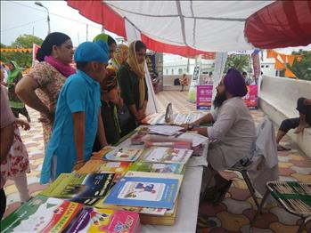 S. Simranjit Singh educating the visitors about Atam Pargas Books