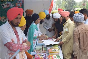 Visitors of all ages engrossed in Atam Pargas Publications