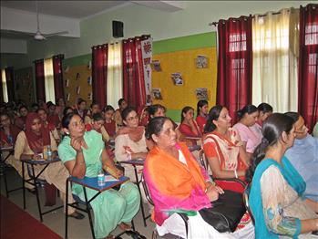 Teacher participants during the event listening carefully to the speaker.
