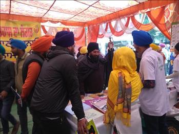 Team Members addressing the queries of visitors