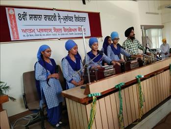 Students doing the Shabd Gayan at the start of the function.