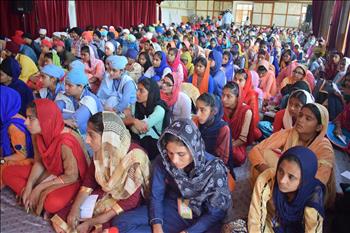 Student at workshop listening to speakers with keen interest