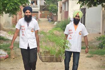 Atam Pargas volunteers carrying the saplings to the plantation site.