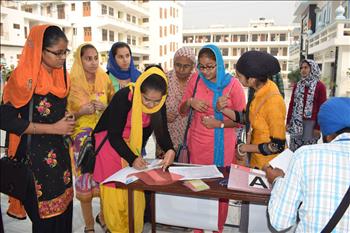 The registration desk set by volunteers for completing registration and distributing welcome kits to delegates