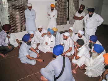 Dr. Varinderpal Singh engaged with farmers to resolve their issues during the event.