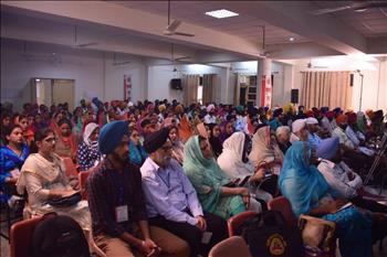 Audience at conference listening to speakers with keen interest